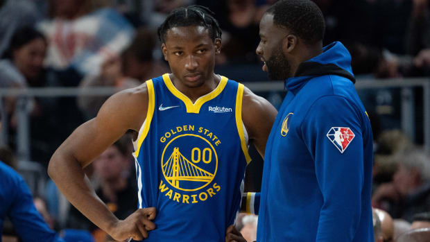 October 30, 2021; San Francisco, California, USA; Golden State Warriors forward Jonathan Kuminga (00) listens to forward Draymond Green (23) during the fourth quarter against the Oklahoma City Thunder at Chase Center. Mandatory Credit: Kyle Terada-USA TODAY Sports